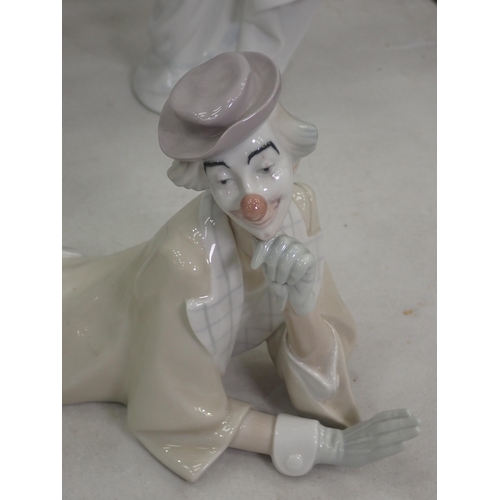 372 - Three Lladro Figurines including a Clown, a Lady with Bouquet and a lady with Bird.