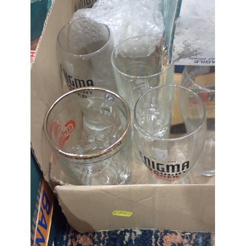 386 - A box of Coca Cola and Nescafe Mugs and Glasses and two boxes of Pint Glasses.