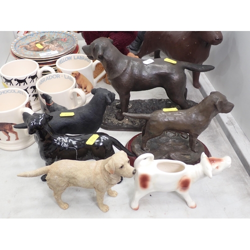 391 - A pottery and partly glazed figure of a Pig signed underneath, six Dog figurines some A/F, four Coff... 