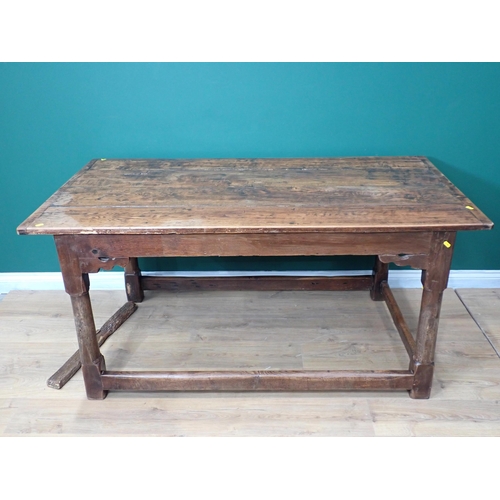 40 - An antique oak Refectory Table utilising early elements with cleated four plank top on turned suppor... 