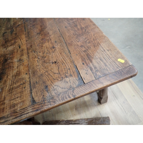 40 - An antique oak Refectory Table utilising early elements with cleated four plank top on turned suppor... 