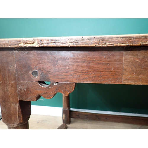 40 - An antique oak Refectory Table utilising early elements with cleated four plank top on turned suppor... 