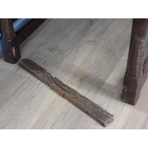 40 - An antique oak Refectory Table utilising early elements with cleated four plank top on turned suppor... 