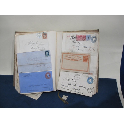 407 - An Album containing a number of 19th Century Postcards, registered letters and envelopes, GB and for... 