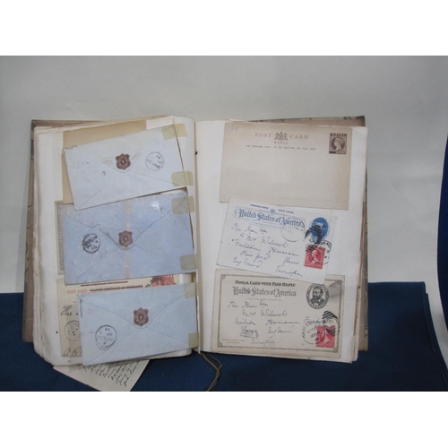 407 - An Album containing a number of 19th Century Postcards, registered letters and envelopes, GB and for... 