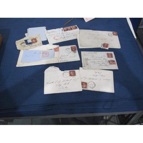 407 - An Album containing a number of 19th Century Postcards, registered letters and envelopes, GB and for... 