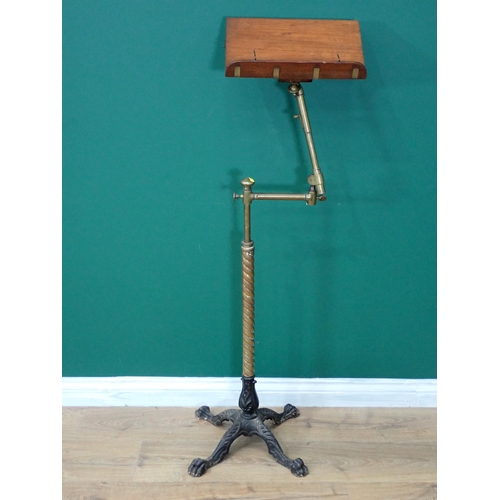 42 - A 19th Century Reading Stand on twisted brass column and four cast iron paw feet by J.Carter