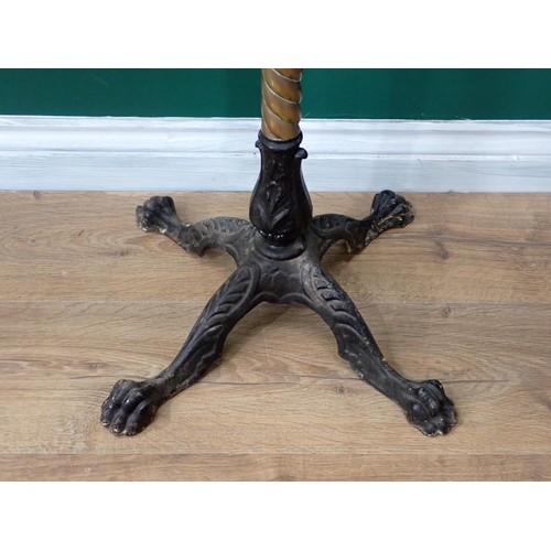 42 - A 19th Century Reading Stand on twisted brass column and four cast iron paw feet by J.Carter