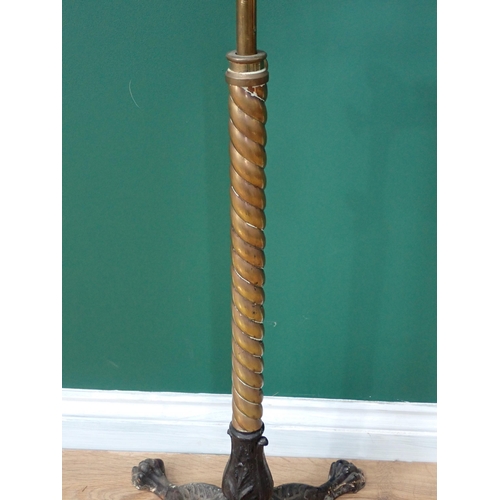 42 - A 19th Century Reading Stand on twisted brass column and four cast iron paw feet by J.Carter