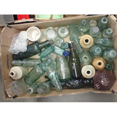 455 - Two boxes of glass and ceramics including, a collection of old glass Bottles, a Beswick Penguin Chic... 