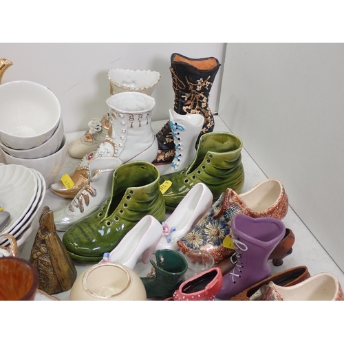 467 - A collection of ceramics including, a German Vase, a quantity of miniature ceramic Shoes and others,... 