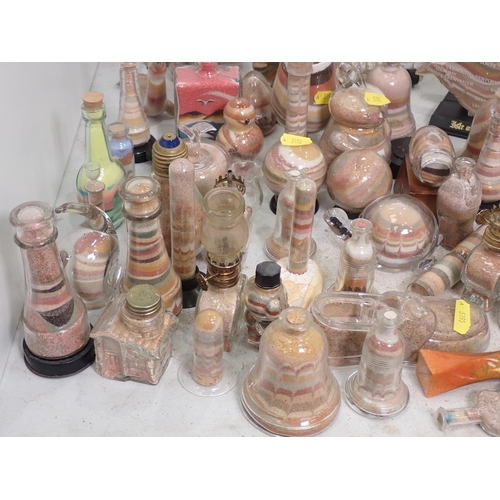 468 - A quantity of Sand filled glass Ornaments including, Animals, Bottles, etc.