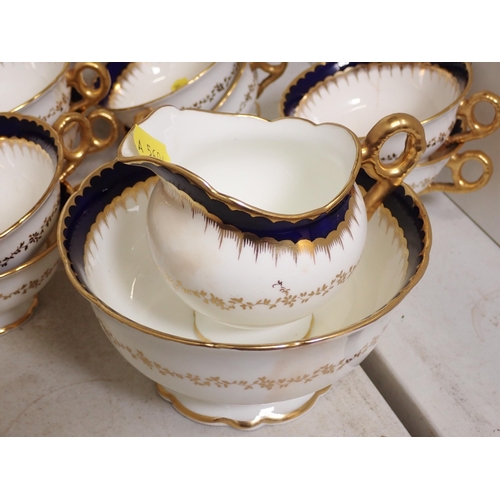 496 - A Coalport Part Tea Set with gilt and blue borders