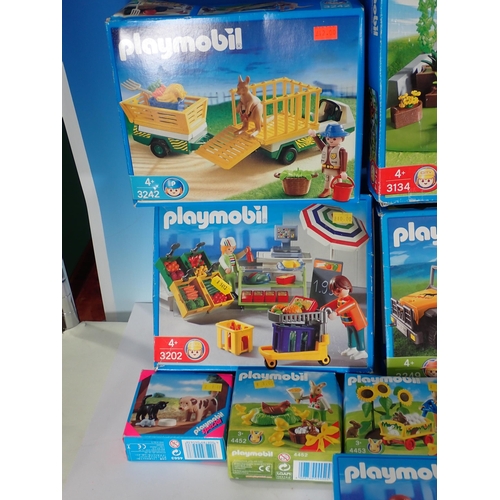 503 - A box of Playmobil Sets, farmyard, shops etc