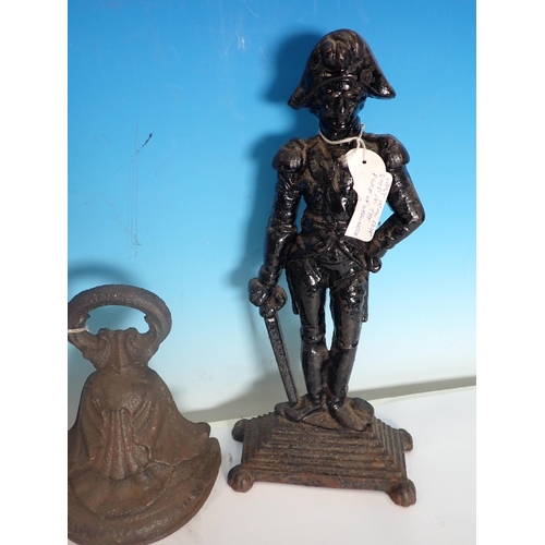 532 - Two Napoleon cast iron Door Stops, and two others