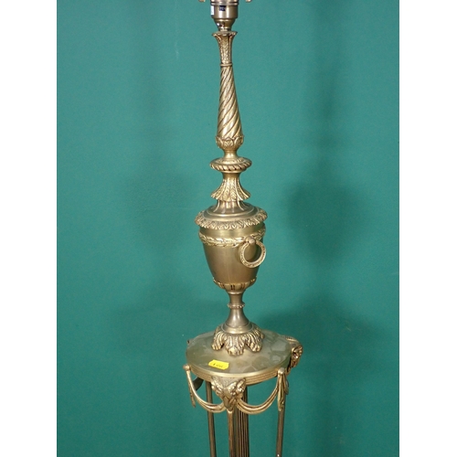 536 - A brass Standard Lamp (passed PAT), of classical designs with ram's head design, 5ft 1in H