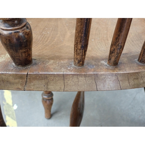 537 - A near pair of Windsor ash back Elbow Chairs with pierced splat backs on turned supports and stretch... 