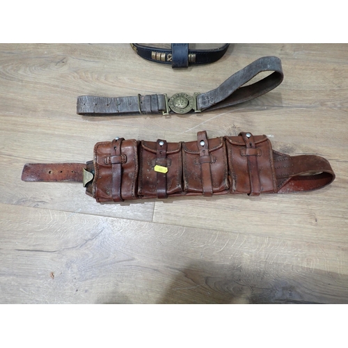 539 - A brass mounted piece of saddlery, a leather ammunition Pouch and a model of Sailing Boat