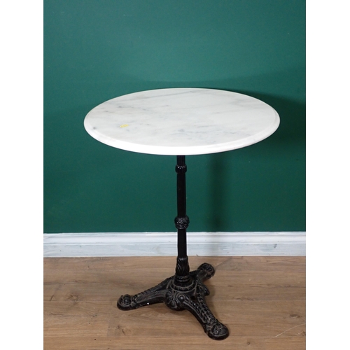 540 - A marble top circular Table with cast iron base