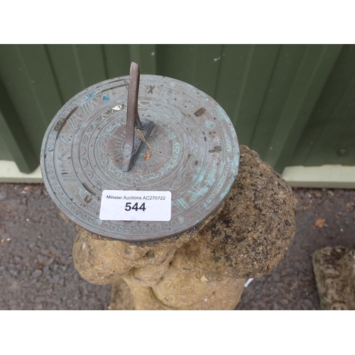 544 - A composite stone Sun Dial in the form of a figure, 2ft 5in H