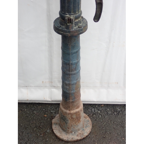 546 - A green painted metal Water Pump, 4ft 7in H