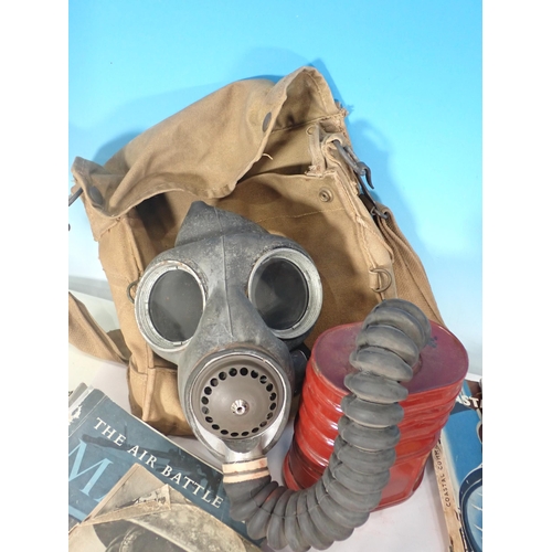 567 - A Gas Mask, canvas Bag and a box of military Ephemera