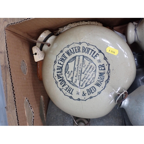 577 - Two boxes of stoneware and metal Hot Water Bottles