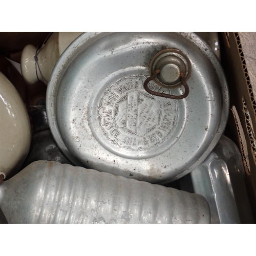 577 - Two boxes of stoneware and metal Hot Water Bottles