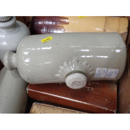 577 - Two boxes of stoneware and metal Hot Water Bottles