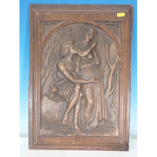 587 - A carved oak Panel in the 17th Century style depicting lovers