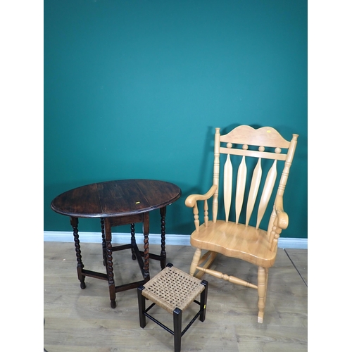 605 - A beech Rocking Chair, oak barley twist dropleaf Occasional Table and a Stool