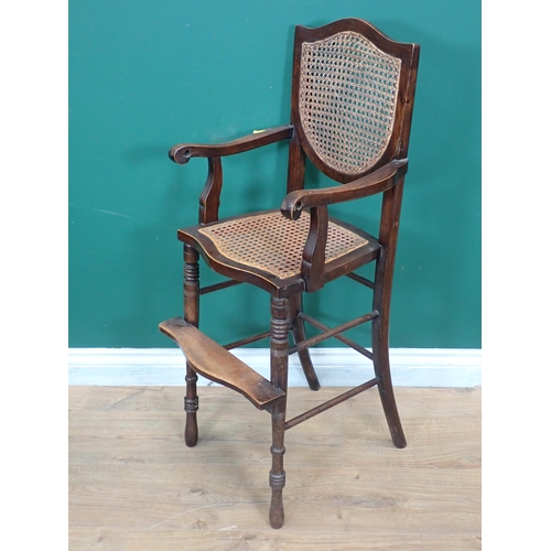 612 - A Victorian mahogany child's High Chair with cane back and seat