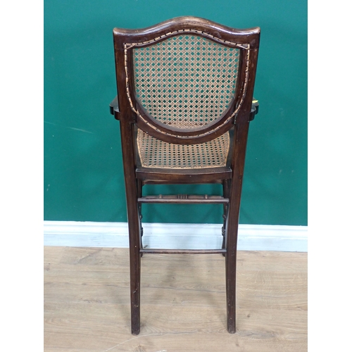 612 - A Victorian mahogany child's High Chair with cane back and seat