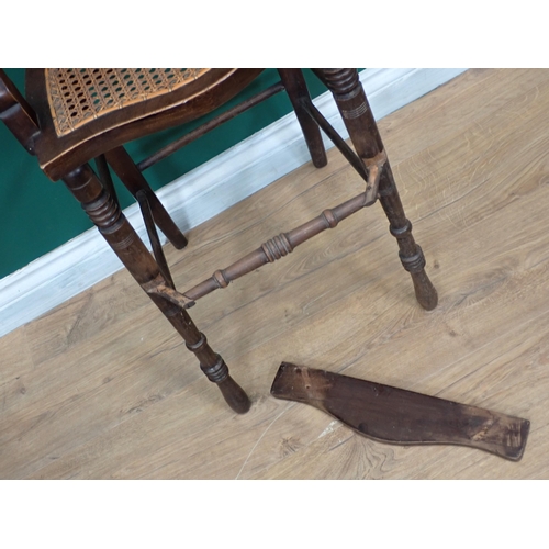 612 - A Victorian mahogany child's High Chair with cane back and seat