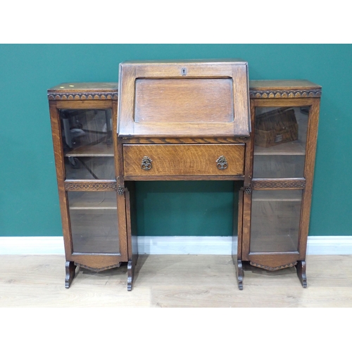 63 - An oak Bureau with fall front flanked by two glazed bookcase sections 3ft 9in W x 3ft 5in H