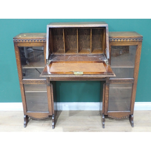 63 - An oak Bureau with fall front flanked by two glazed bookcase sections 3ft 9in W x 3ft 5in H