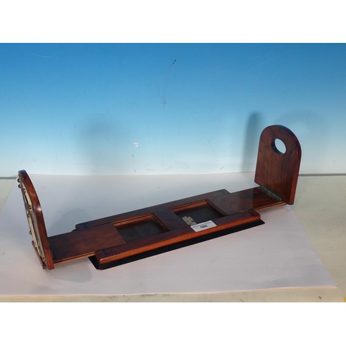 588 - A Victorian walnut sliding Book Trough