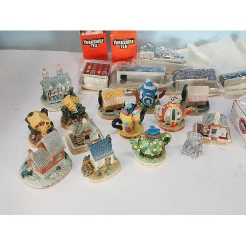 650 - A quantity of Wade Figurines, Marbles, replica Shell Sign, etc.