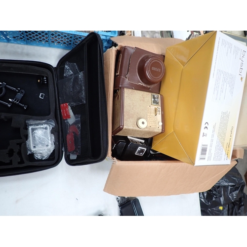 662 - A box of Cameras including Ilford, Praktika, Paxina, a boxed Minette Eva-Vision Slide Projector and ... 