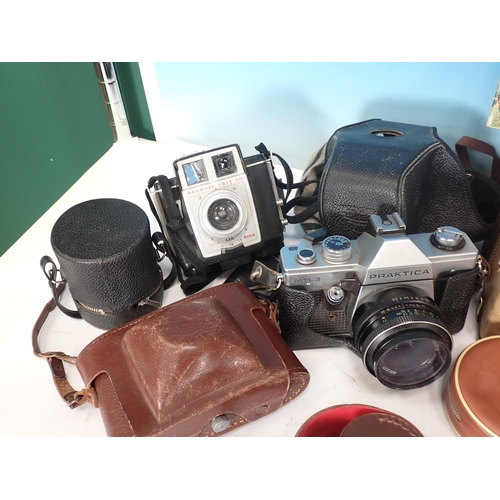 662 - A box of Cameras including Ilford, Praktika, Paxina, a boxed Minette Eva-Vision Slide Projector and ... 