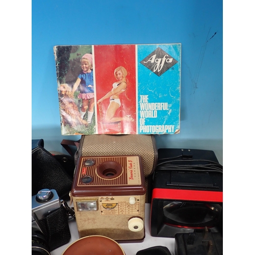 662 - A box of Cameras including Ilford, Praktika, Paxina, a boxed Minette Eva-Vision Slide Projector and ... 