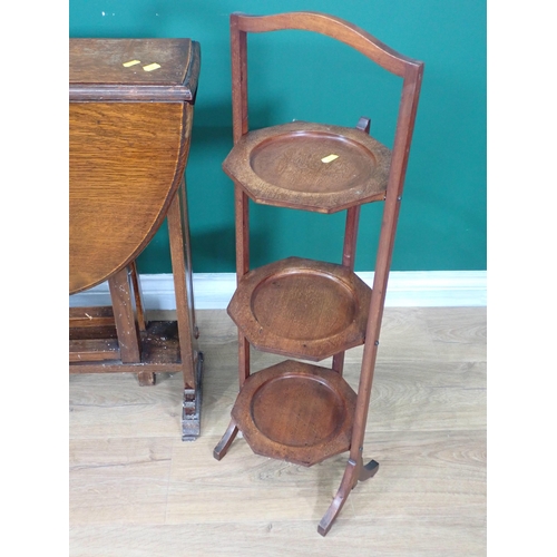 67 - A square mahogany Occasional Table, an oak Sutherland Table and two folding Cake Stands