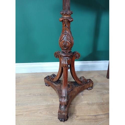 70 - A 19th Century rosewood circular Pillar Table mounted upon leafage carved baluster column and three ... 