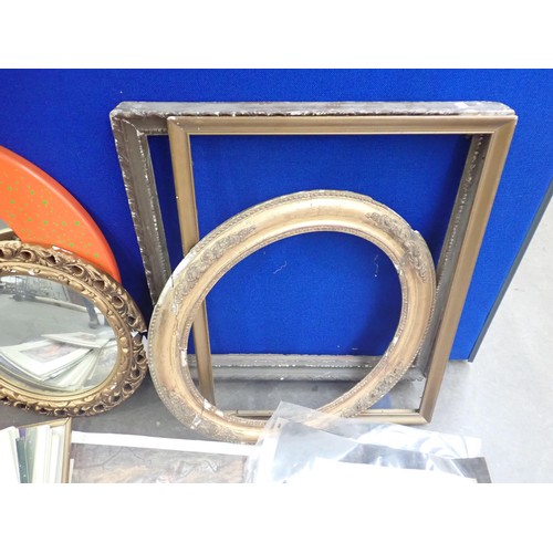 672 - A modern orange framed circular Wall Mirror, gilt framed Mirror and a quantity of Prints and Frames