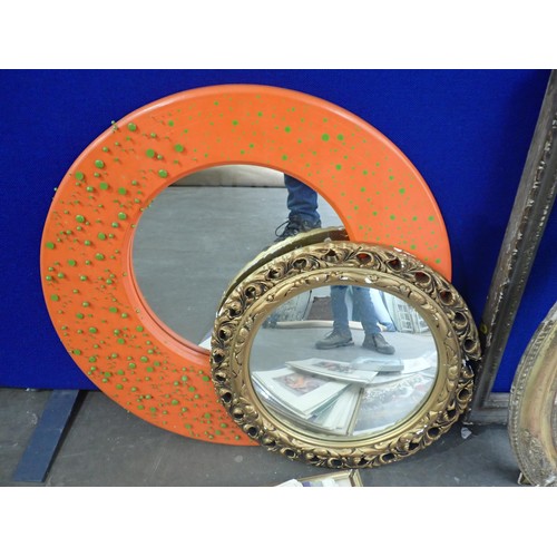 672 - A modern orange framed circular Wall Mirror, gilt framed Mirror and a quantity of Prints and Frames