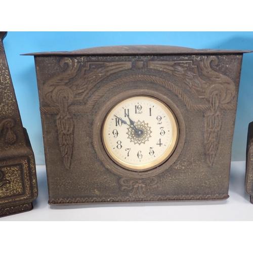 711 - A tin three piece Clock Garniture/Biscuit Tins with embossed decoration, 10in H