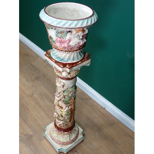 729 - A Capo Dimonte Jardiniere on stand with moulded design of allegorical scene, 3ft 6in H