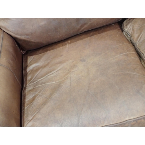 72A - A tan leather two seat Settee 5ft 5in w