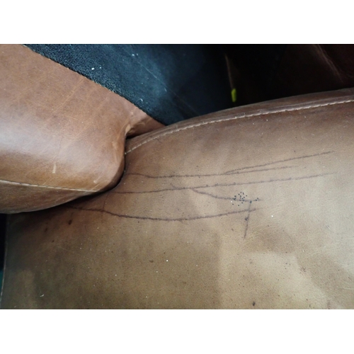 72A - A tan leather two seat Settee 5ft 5in w