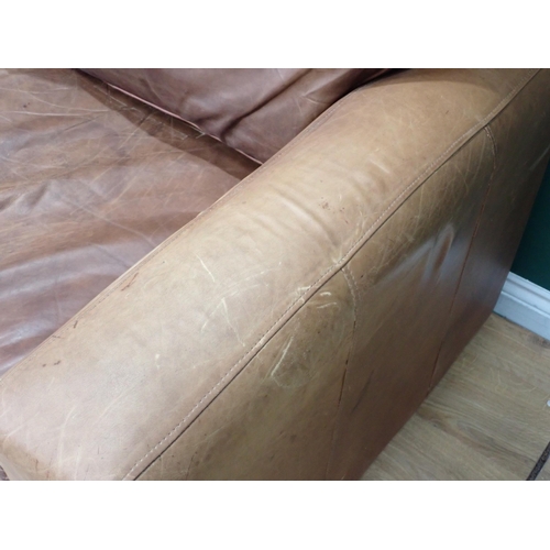 72A - A tan leather two seat Settee 5ft 5in w